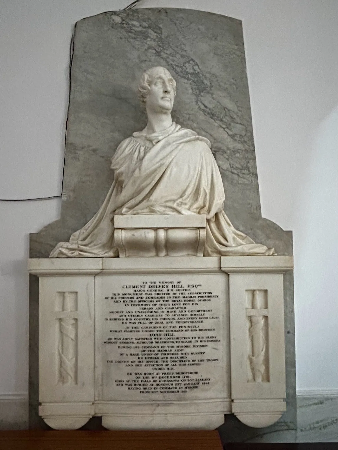 Marble memorial tablet with a carved figure